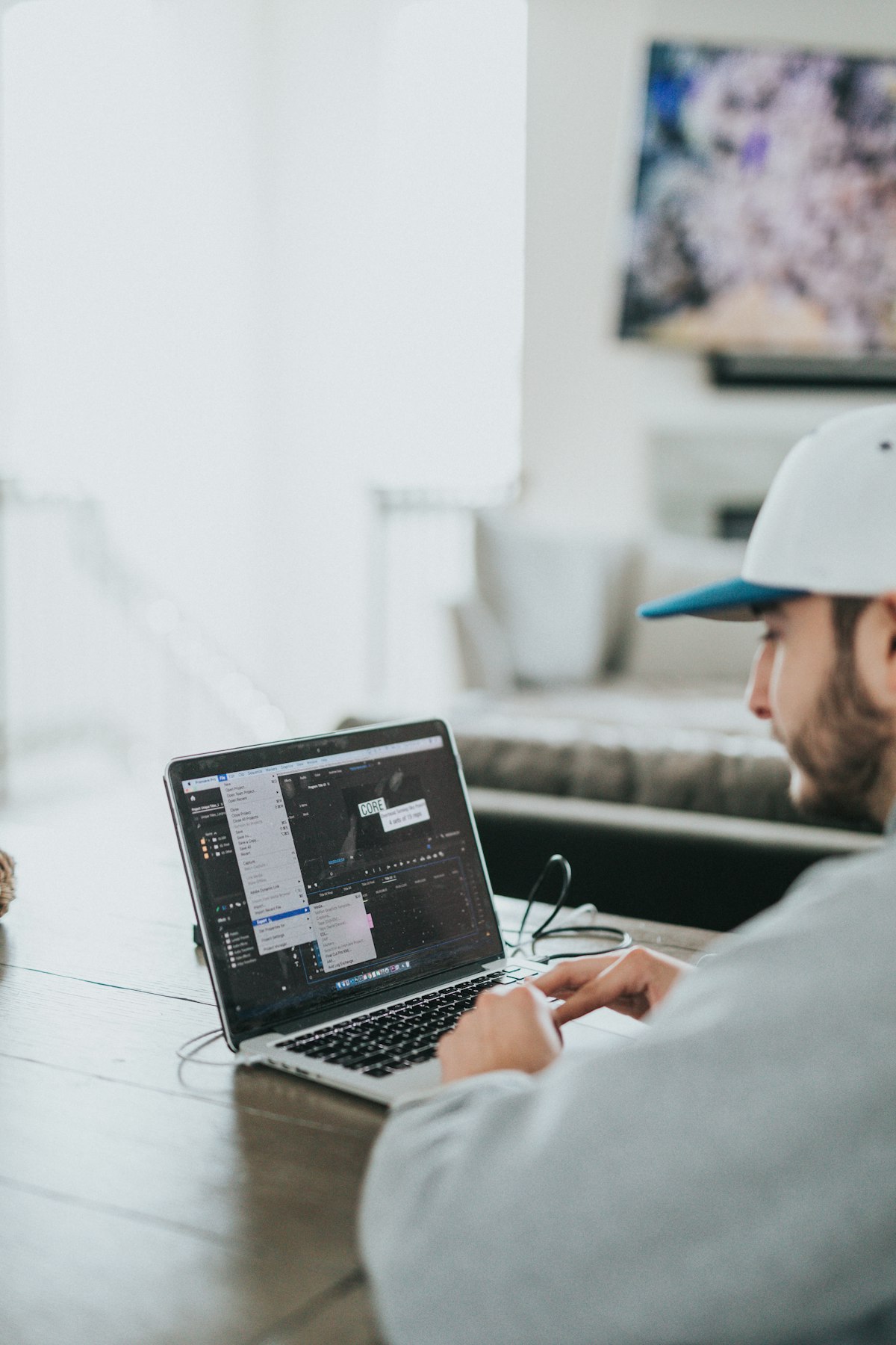 Person working at a laptop in a home office