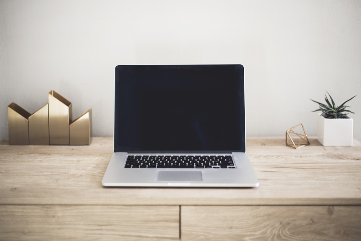 Laptop computer on a clean wooden desk